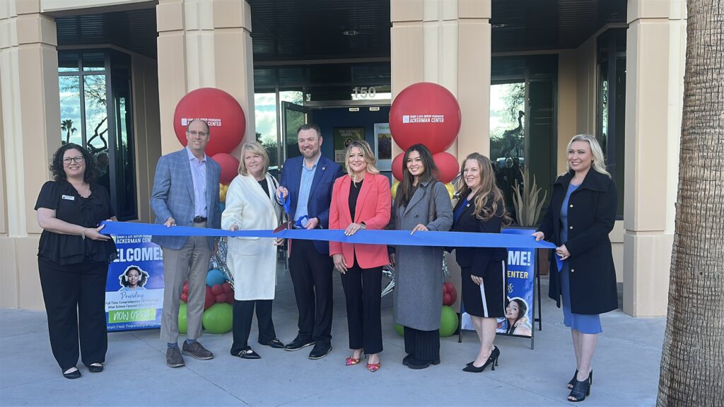 Ribbon-cutting ceremony with community members and supporters at a Grant a Gift Autism Foundation event